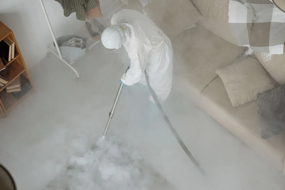 Biohazard cleanup technician in protective equipment, Wrightsville, GA